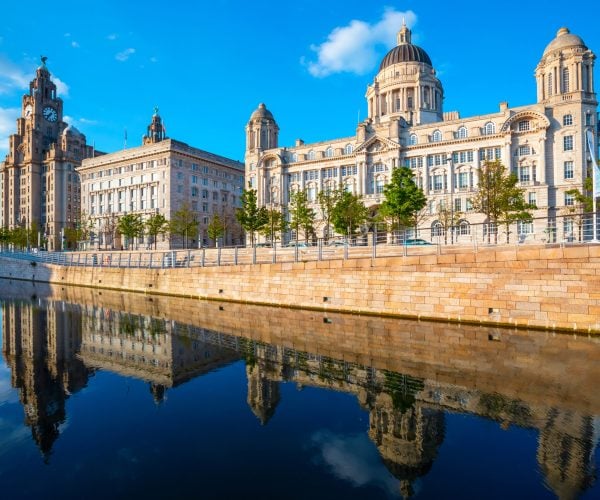 Liverpool, UK - May 18 2018: Liverpool Pier Head with the Royal Liver Building, Cunard Building and Port of Liverpool Building part of the Liverpool Maritime Mercantile City UNESCO World Heritage Site
